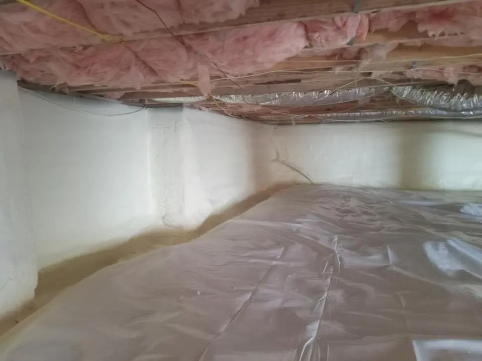 Crawl space encapsulation with closed-cell spray foam for Commercial Roof Restoration in Clinton